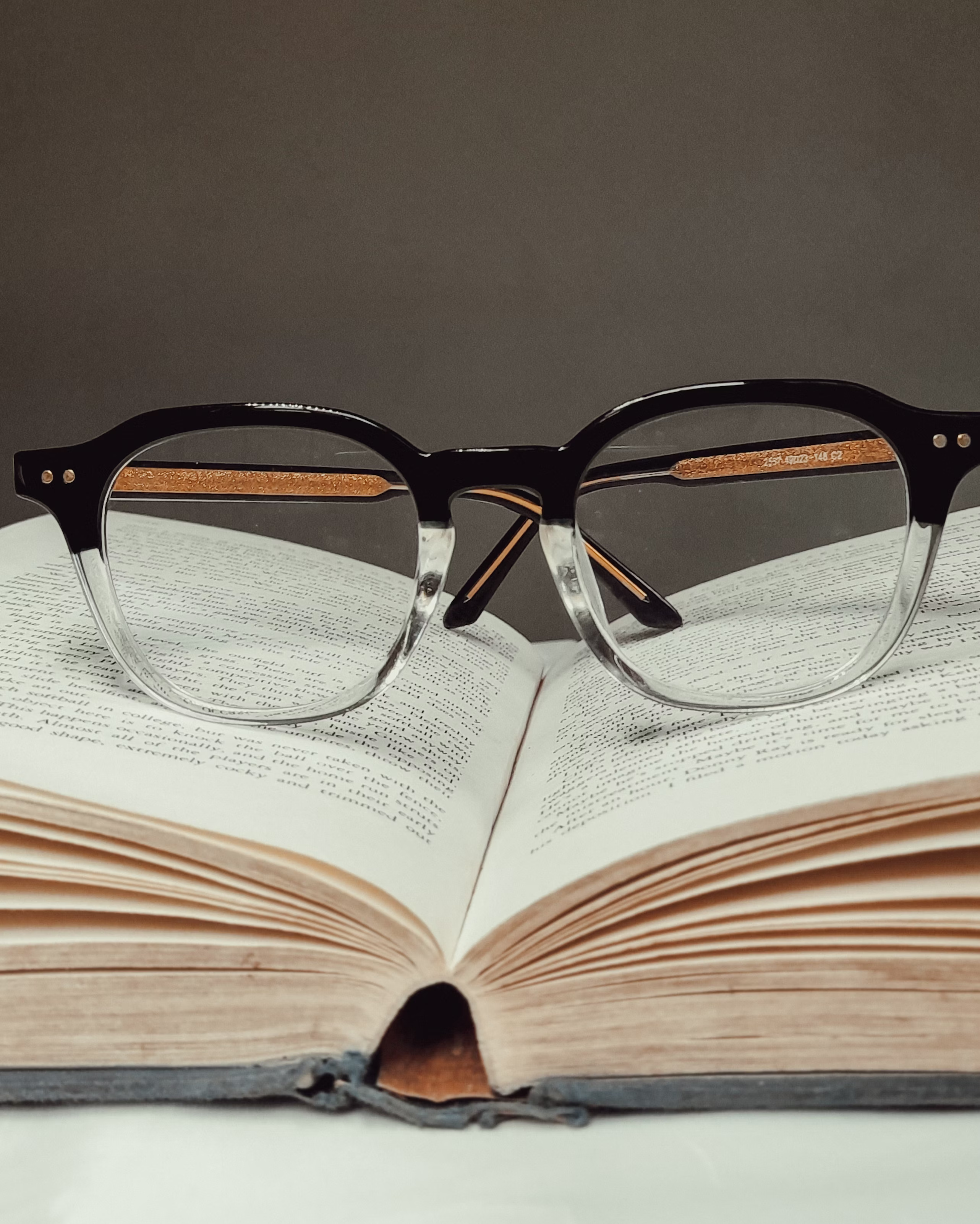Glasses resting on open book
