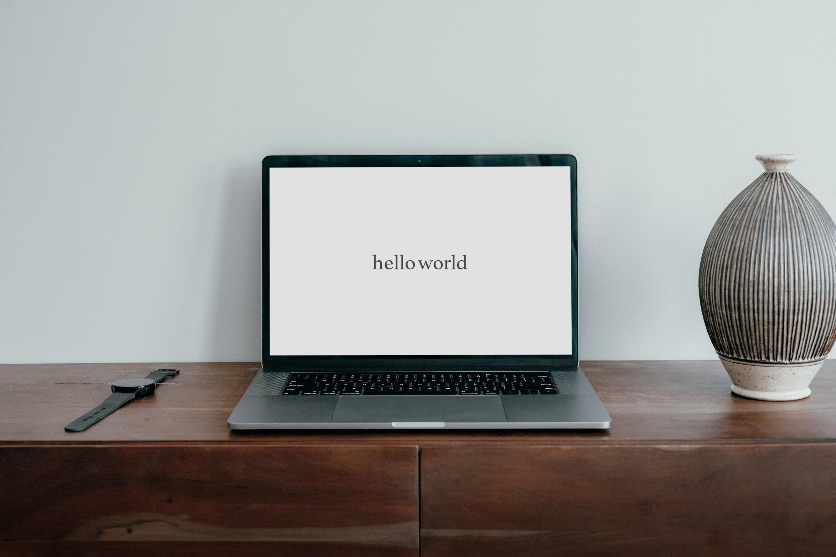 laptop screen that says hello world