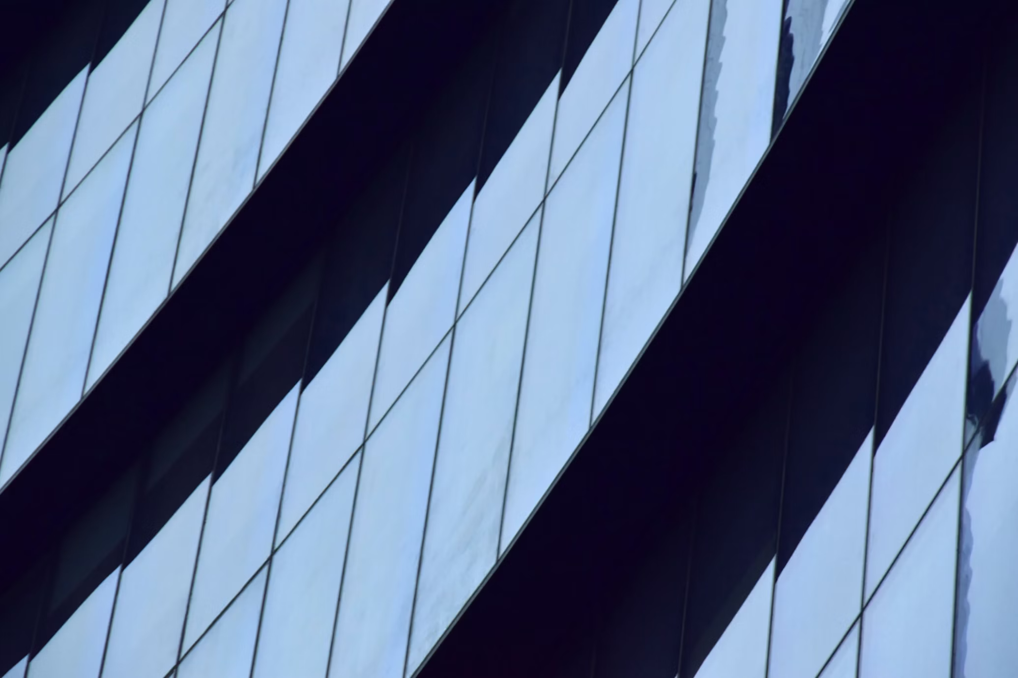 tiled windows arranged in a diagonal formation. photo by Anna Bakirova on Unsplash
