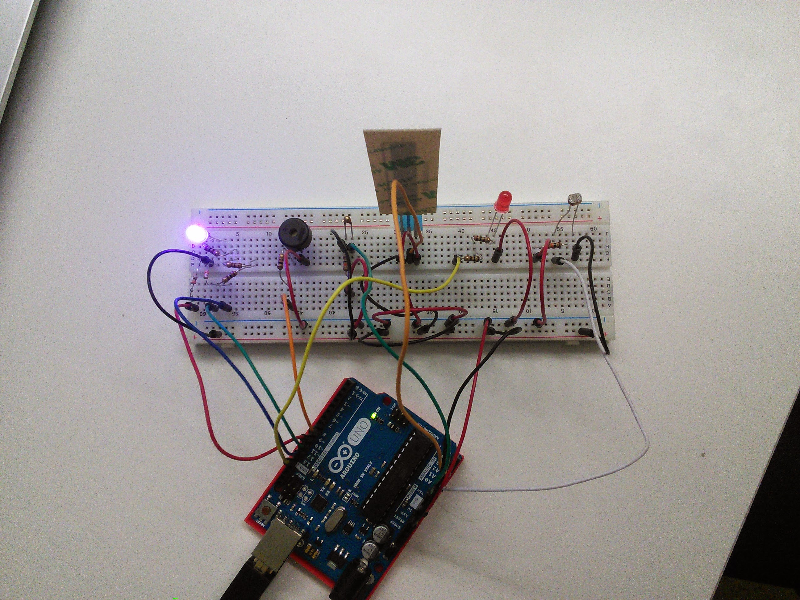 Image of an Arduino board that lights up.