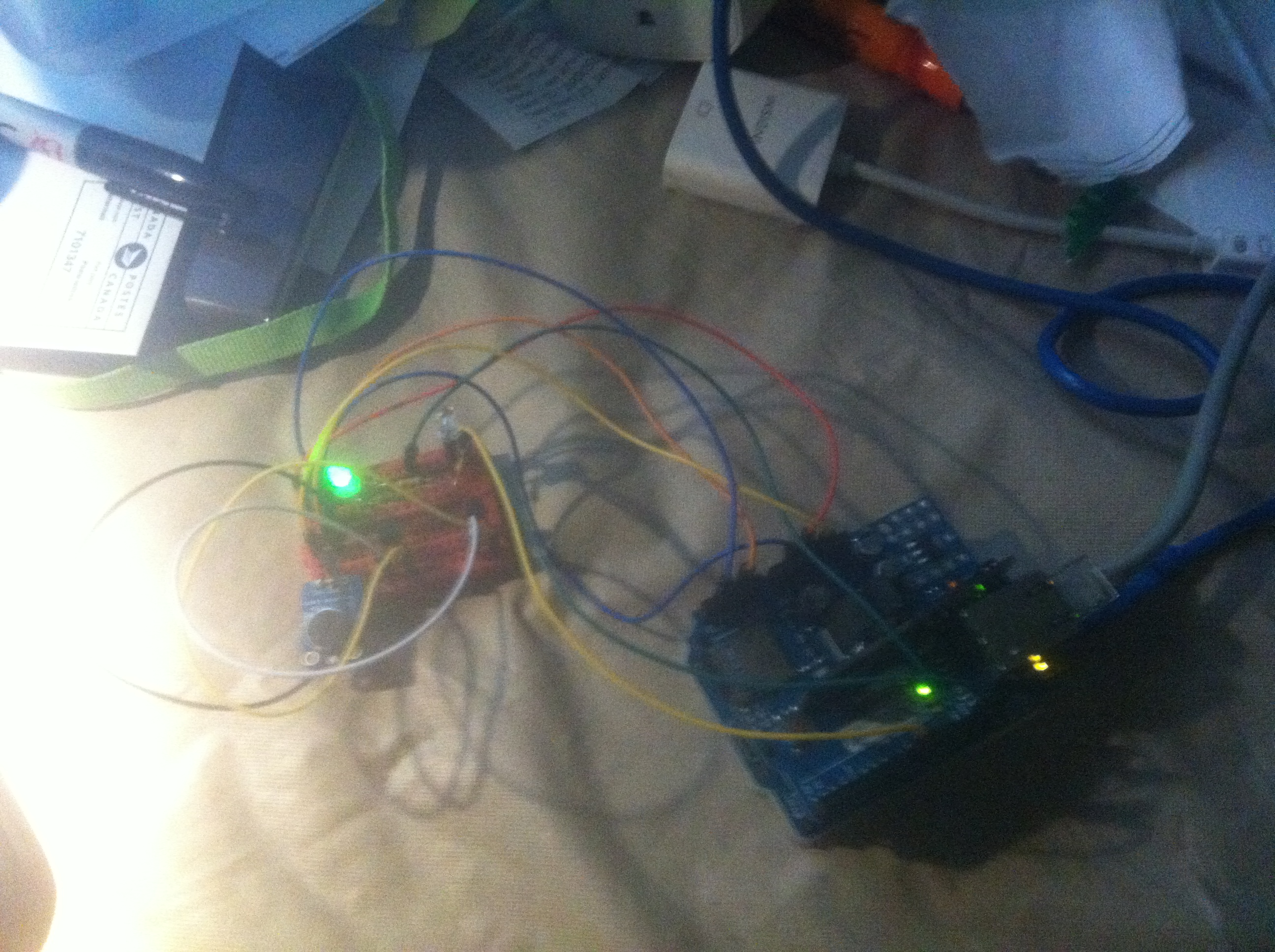 Arduino boards with multicoloured wires and green lights