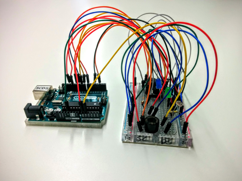 Maddie's Arduino device. Two circuit boards are connected by many wires.