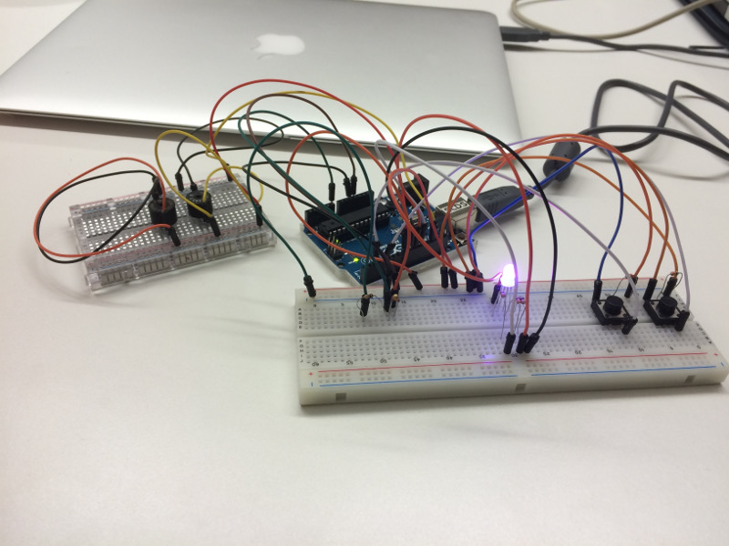 Kat's Arduino device. It features a purple light bulb