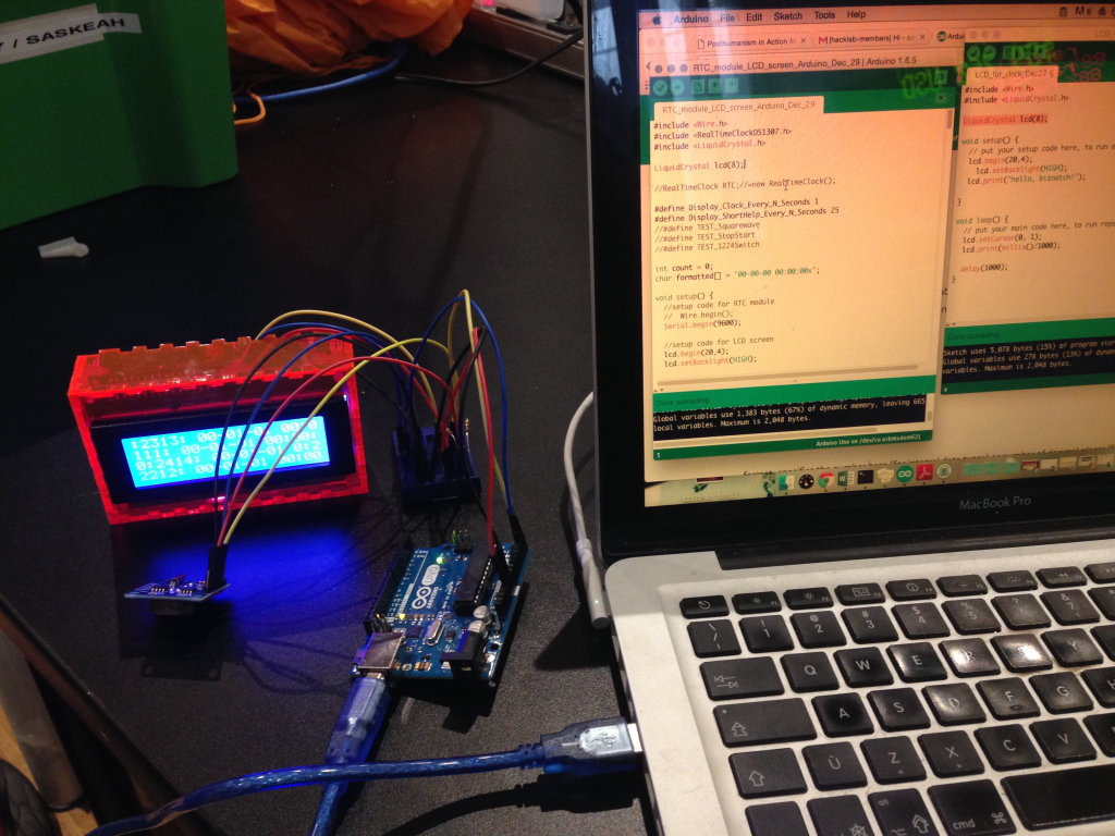 Image of an Arduino machine hooked up to a computer
