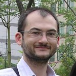 Photo of SCDS Grad Resident Chris Handy. He is standing outside and smiling.