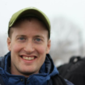 Photo of SCDS Grad Resident Jeremy Parsons. He is standing outdoors and smiling.